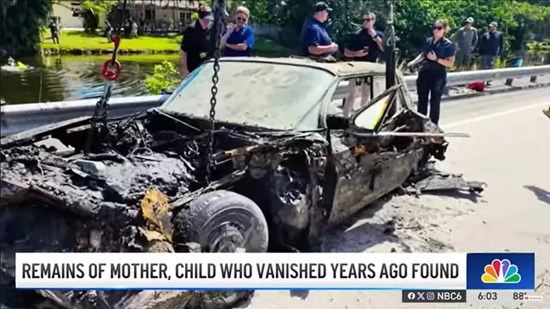 Image: A rusted vehicle is recovered from a Plantation canal after Sunshine State Sonar discovered the wreckage believed to contain the remains o Caren and Doris Wurst.
