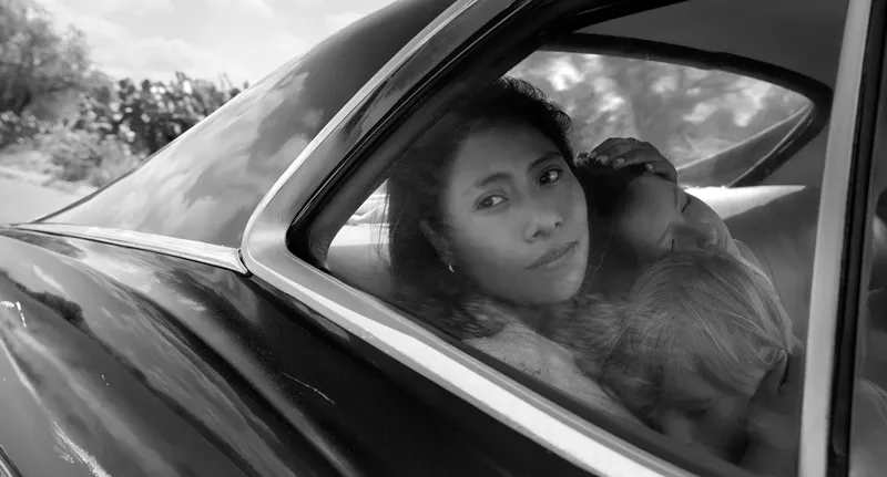 Image: Yalitza Aparicio plays Cleo, the caretaker of a privileged family in the early ’70s who also becomes the soul sister and friend to matron of the home Sofia in Alfonso Cuarón’s autobiographical film Roma.