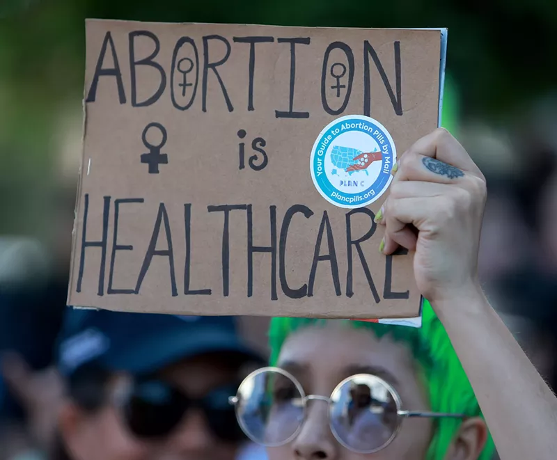 Image: A protester in Miami after the U.S. Supreme Court overturned Roe v. Wade on June 24, 2022