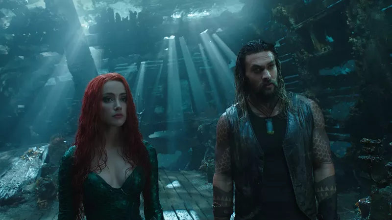 Image: Jason Momoa (right) plays Aquaman, a hard-drinking surface-dweller townie raised in a Massachusetts lighthouse, and Amber Heard is Atlantean battle-mermaid Mera in James Wan’s superhero epic.