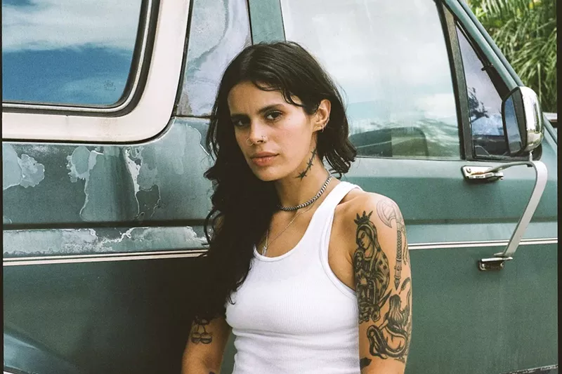 Image: Artist Elle Barbeito hunts for invasive pythons to create sustainable fashion and functional art.