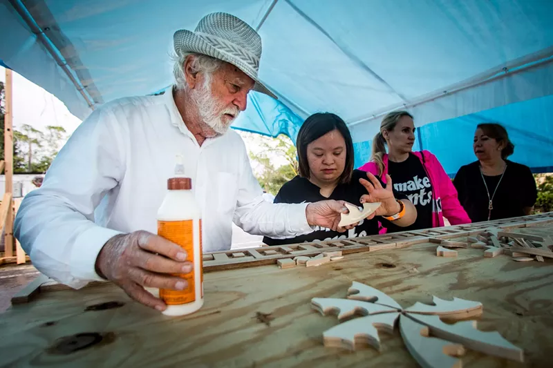 Image: Artist David Best works with volunteers to build Temple of Time.