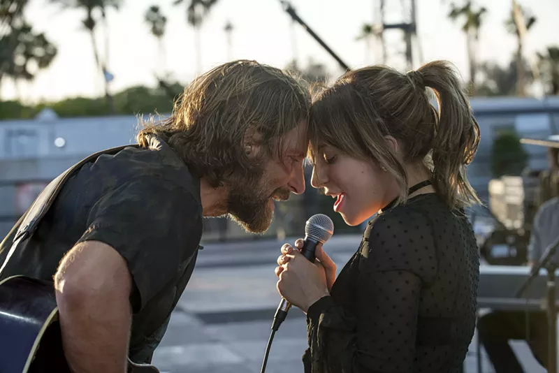 Image: Bradley Cooper (left) makes his directorial debut and costars with Lady Gaga in the latest version of A Star Is Born, in which aging rock ’n’ roller Jackson Maine discovers Ally, a struggling cabaret performer who goes on to gain pop fame.