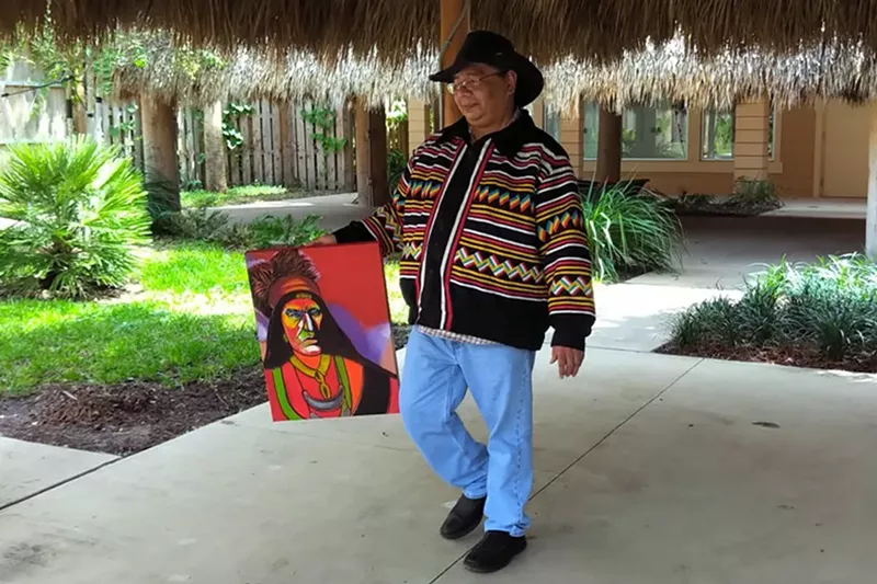 Image: Elgin Jumper shows his Seminole Warrior from the Patchwork Mosaic collection on display at History Fort Lauderdale.