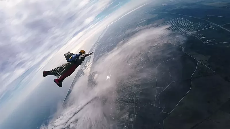 Image: North Miami Beach's Mike Ramirez soars above Earth in his wingsuit.