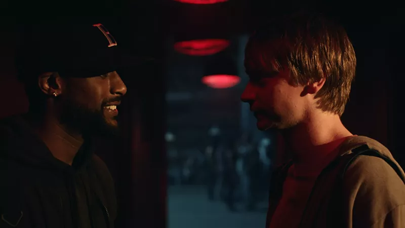 Image: Calum Worthy (right) plays grad student Adam Merkin, who gets hooked on battle-rap competitions after consulting with a master named Behn Grymm (Jackie Long), in director Joseph Kahn's Bodied.