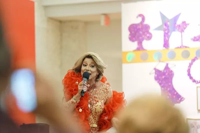 Image: Joan Rivers impersonator Joe Posa speaks at the opening reception for "I Am What I Am."