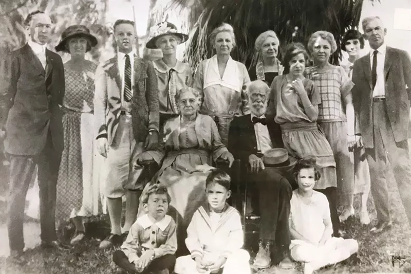 Image: The Bryan family, circa 1920, with patriarch Philemon Bryan sitting at center with his wife, Lucy.