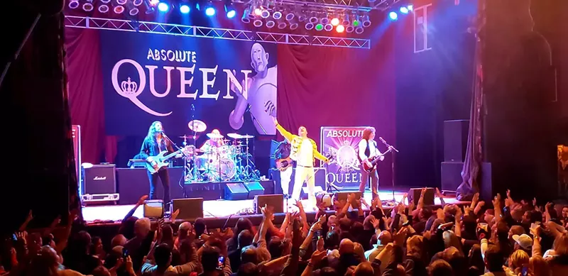 Image: Martyn Jenkins, lead singer of Absolute Queen, performs with his band.