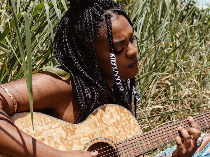 Image: Kaylan Arnold's first love was the piano, but she quickly pivoted to the guitar.