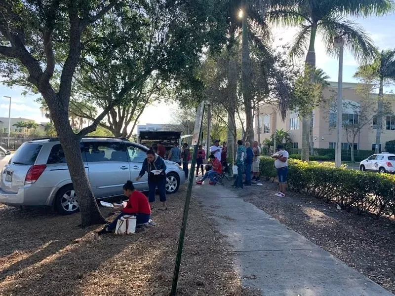 Image: A food truck serves hungry immigrants taking a break from the long lines outside the Broward County ICE facility in Miramar.
