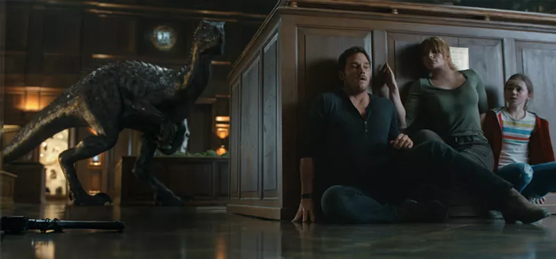 Image: A new hybrid dinosaur called the Indoraptor threatens (from left) Owen Grady (Chris Pratt), Claire Dearing (Bryce Dallas Howard) and Maisie Lockwood (Isabella Sermon) in Jurassic World: Fallen Kingdom.