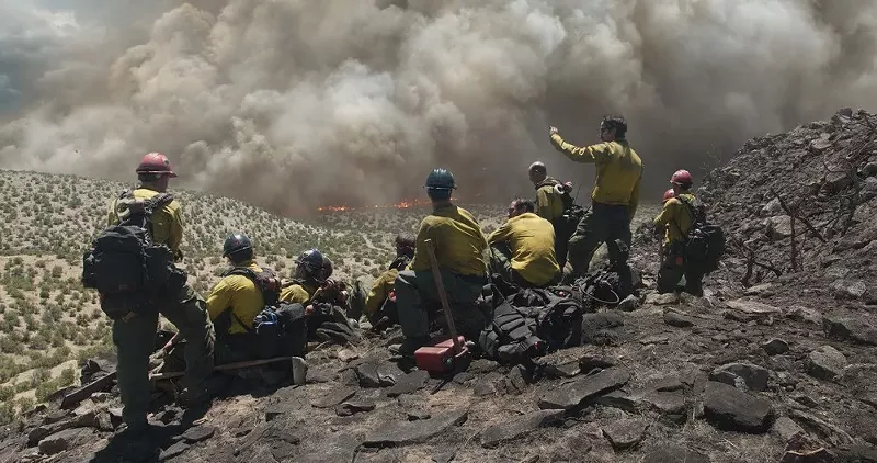 Image: Director Joseph Kosinski's Only the Brave follows a group of firefighters who work the front lines of raging wildfires, using axes and chainsaws to cut down trees and chaparral.