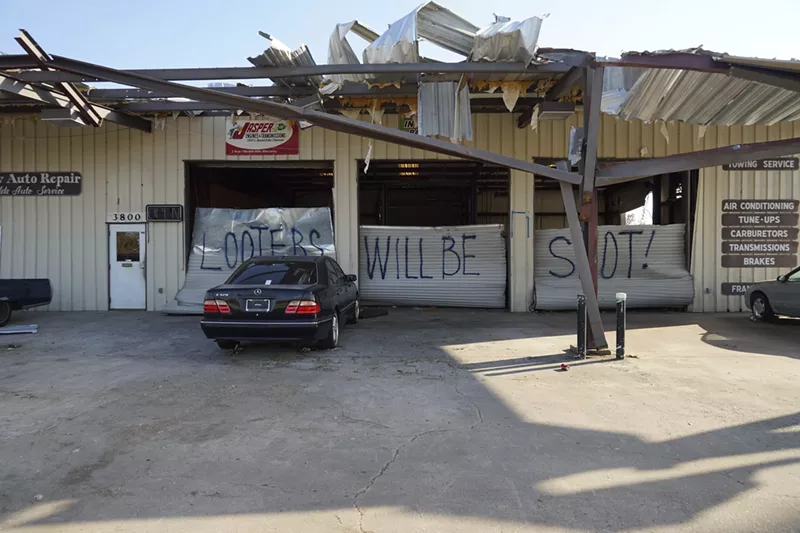 Image: Public order in Panama City has taken a hit in the wake of Hurricane Michael. A damaged mechanic's shop in the Springfield neighborhood bears a grim and familiar warning.