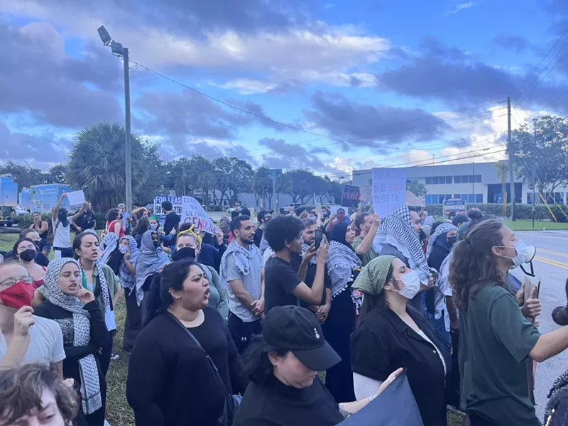 Image: Opponents protesting Israeli airstrikes in Gaza gather outside Real-Time Laboratories' offices in Boca Raton on November 9. (Photo was provided by a protester on the condition his name not be published.)