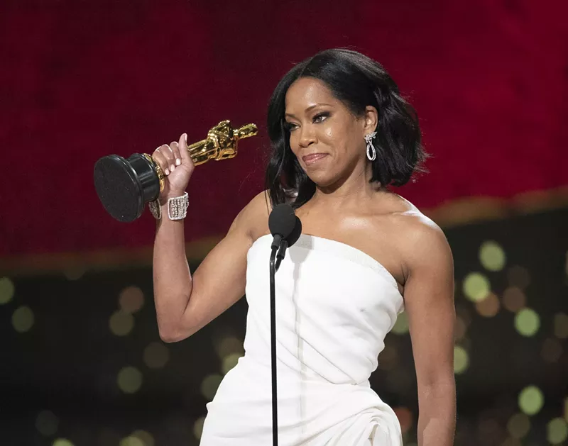 Image: Regina King accepts her Oscar for best supporting actress.