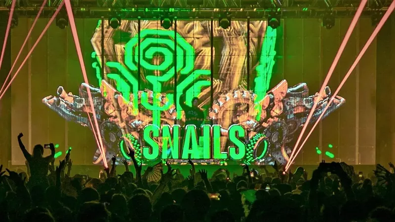 Image: Frédérik Durand, AKA Snails, blasts his audience with bone-shaking bass and retina-searing holographic images during his World of Slime Tour in 2019.