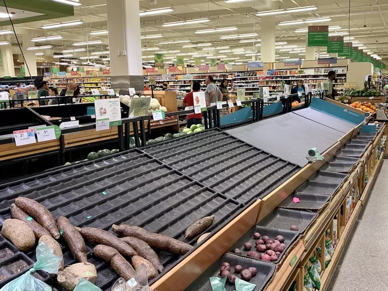 Image: A nearly empty produce aisle at a Miami-area Publix.