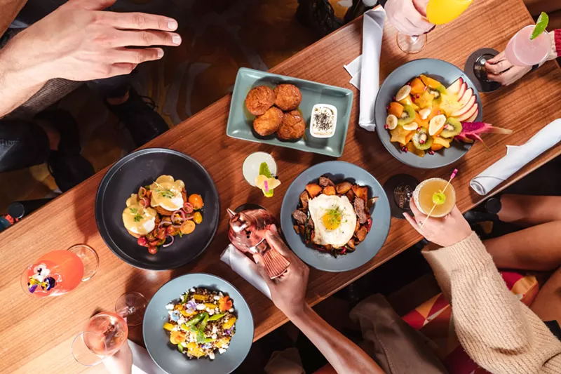 Image: Sunday brunch has arrived at Sparrow, with fried biscuits, bottomless punch bowls, and rooftop views.