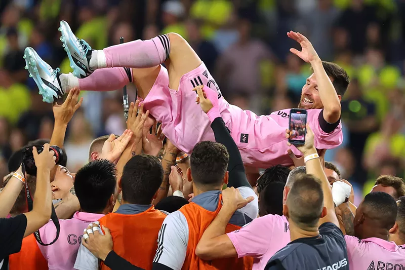 Image: Inter Miami teammates hoist Lionel Messi following their win in the Leagues Cup final on August 19, 2023.