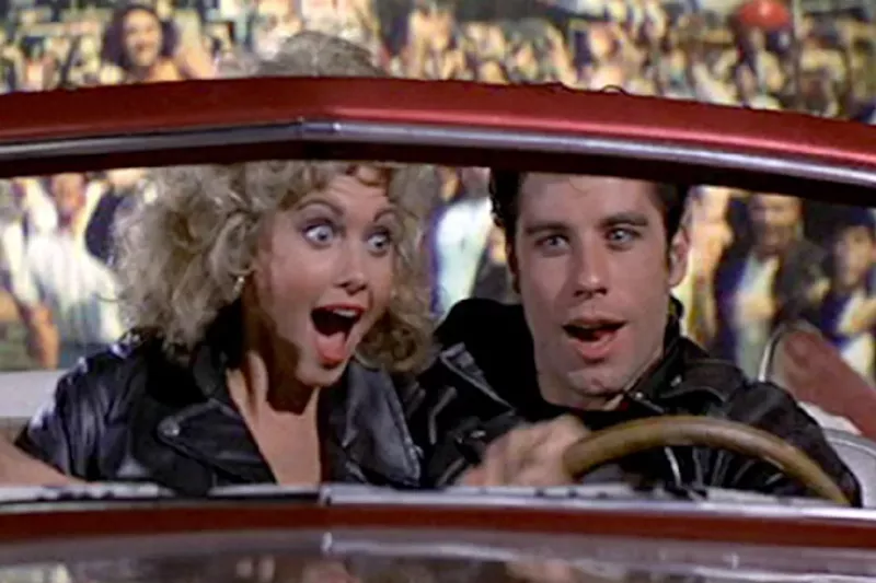 Image: Olivia Newton-John and John Travolta reprise their roles from 1978's Grease for a singalong in West Palm Beach.