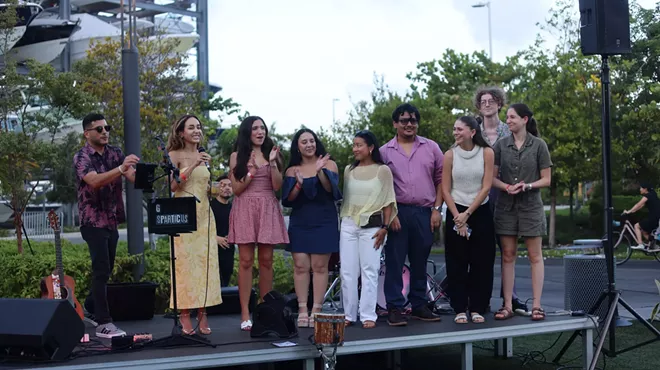 Journalists lined up on an elevated outdoor stage