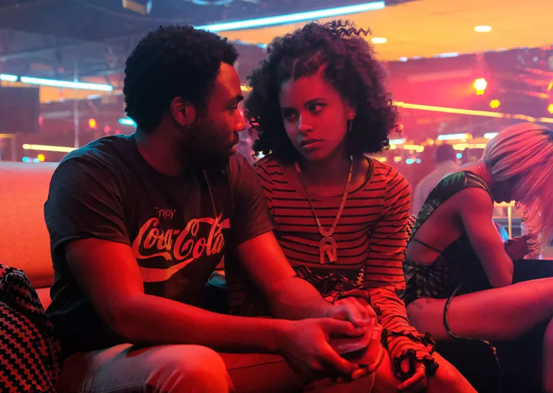 Image: Donald Glover (left), the creator, cowriter and star of the FX series Atlanta, appears in a scene with Zazie Beetz.