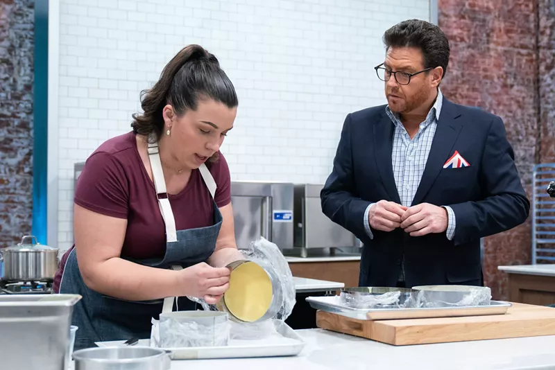 Image: Contestant Julie Franceschini plating alongside Food Network's Scott Conant.