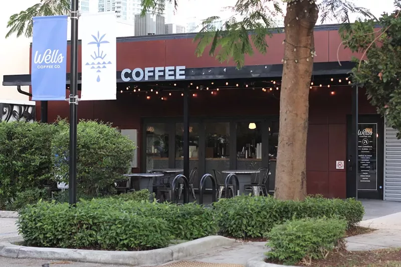 Image: The bright confines and patio at Wells Coffee's newly opened spot in Fort Lauderdale.