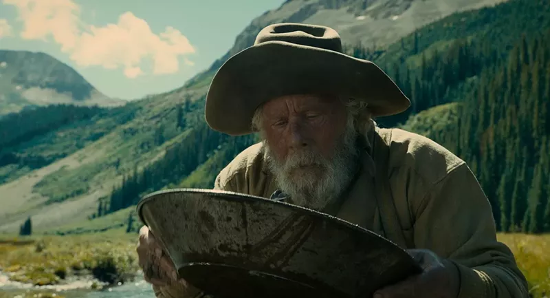 Image: Tom Waits plays an old prospector who meticulously searches for a gold pocket near a pristine stream in The Ballad of Buster Scruggs, the Coens brothers’ new Western anthology film.